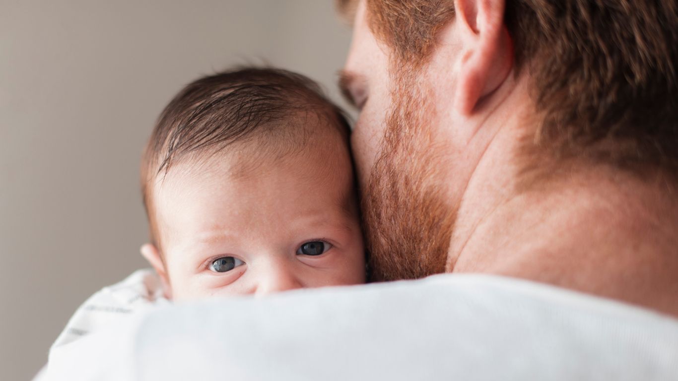 close-up-father-holding-baby-back-view racing for mental health blog
